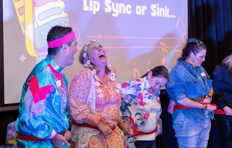 Teams laughing during a fun team building event