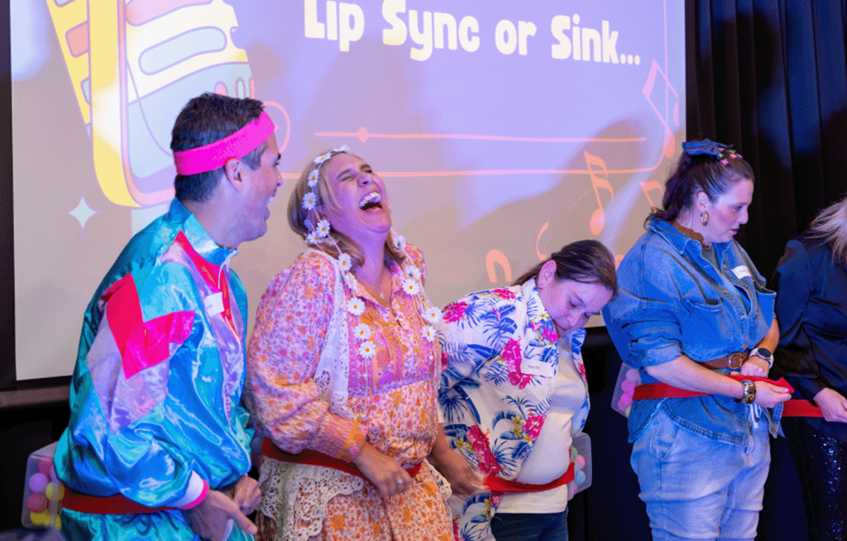 Teams laughing during a fun team building event