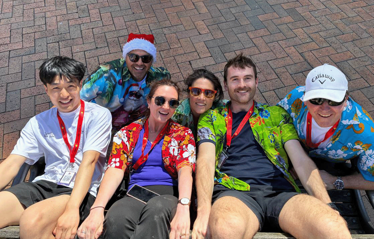 Group laughing during outdoor team bonding event in Sydney